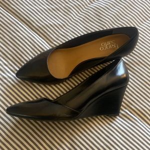 Black leather wedge pumps